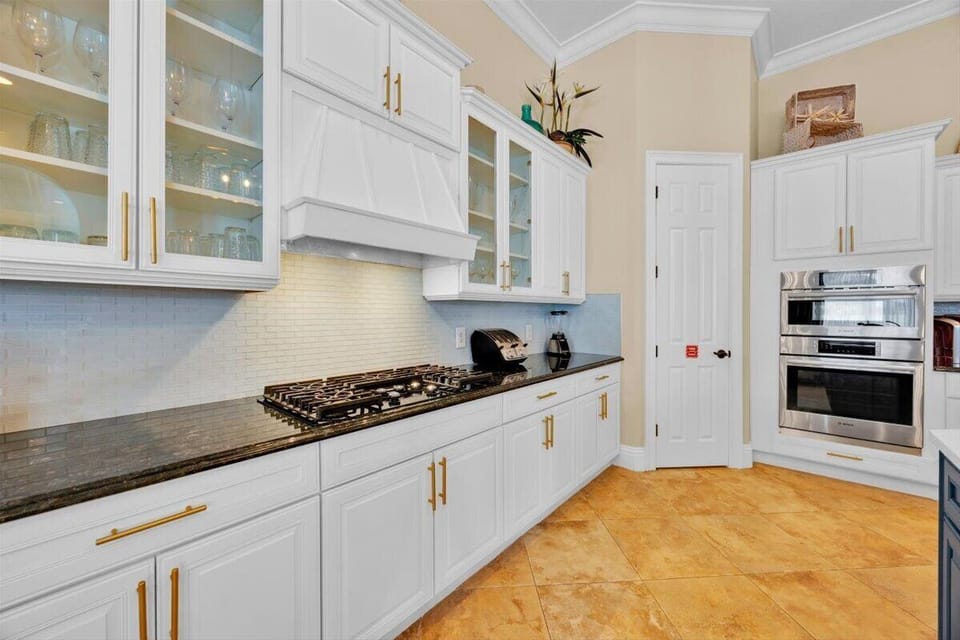 New appliances-Gas cooktop with lighted overhead vent hood, microwave and oven.