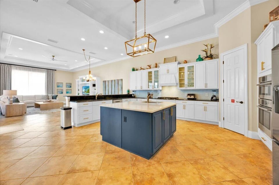 Large kitchen Quartz island with 2 full size sinks and wonderful walk in pantry!