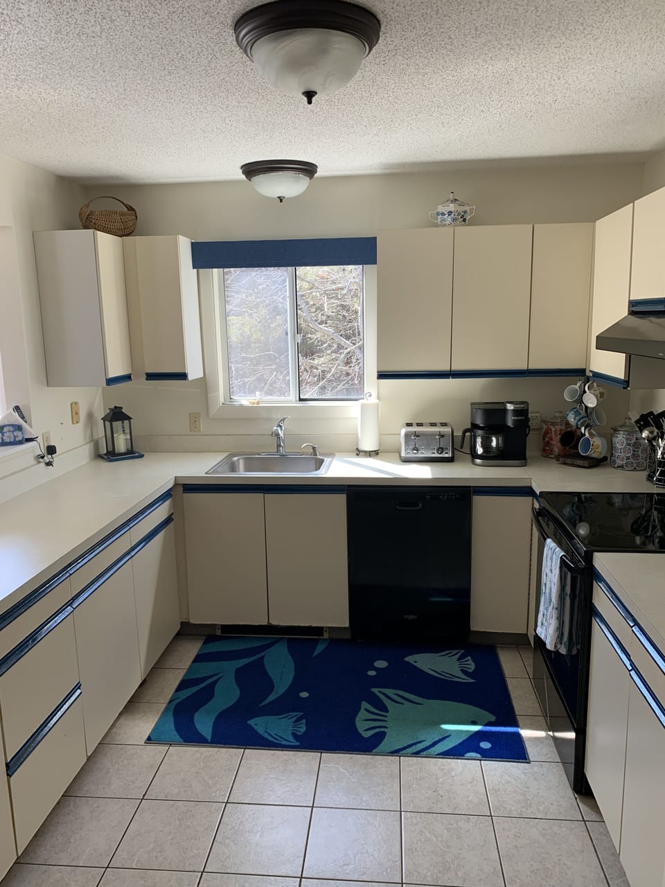 Kitchen with dishwasher and cooktop stove. Keurig coffee maker (does cups/pots)