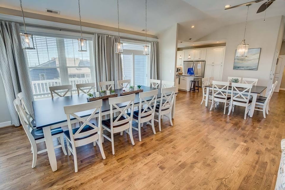 Top-Level Dining Room with Table (seats 12) and Additional Table (seats 8)