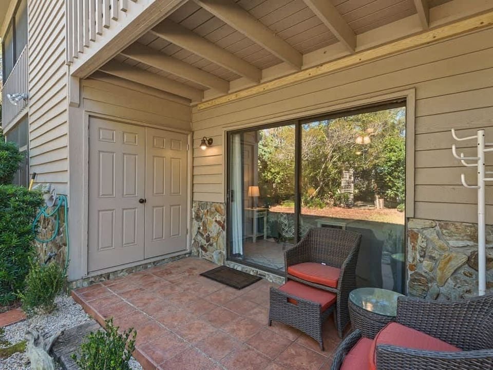 Enjoy the beautiful back patio and Cassine Garden foliage.