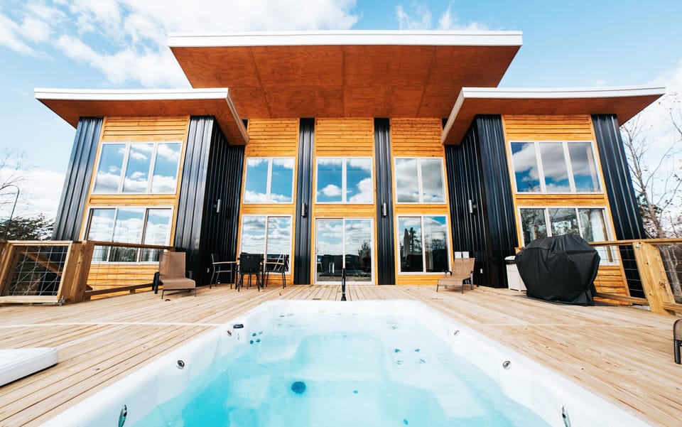 Rear deck, home to our heated, all year round swin spa and hot tub.