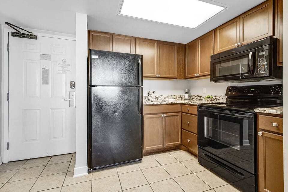 Explore modern kitchen aesthetics in our suite, featuring sleek cabinetry, state-of-the-art appliances, and a minimalist design that complements the overall contemporary feel of the space.