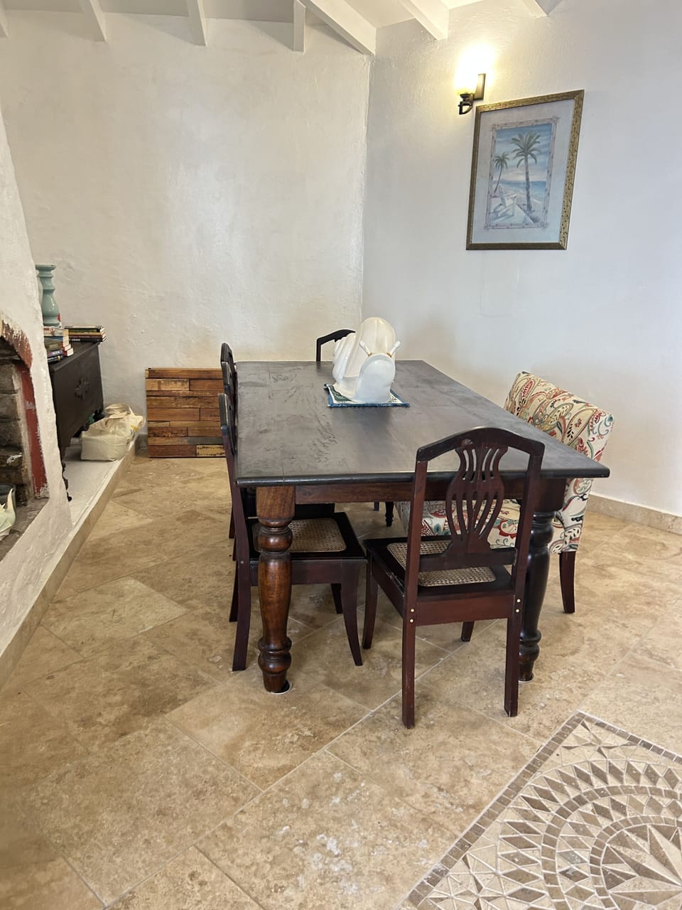 Indoor dining seats 8, antique chairs, library nook on side; opens to porch