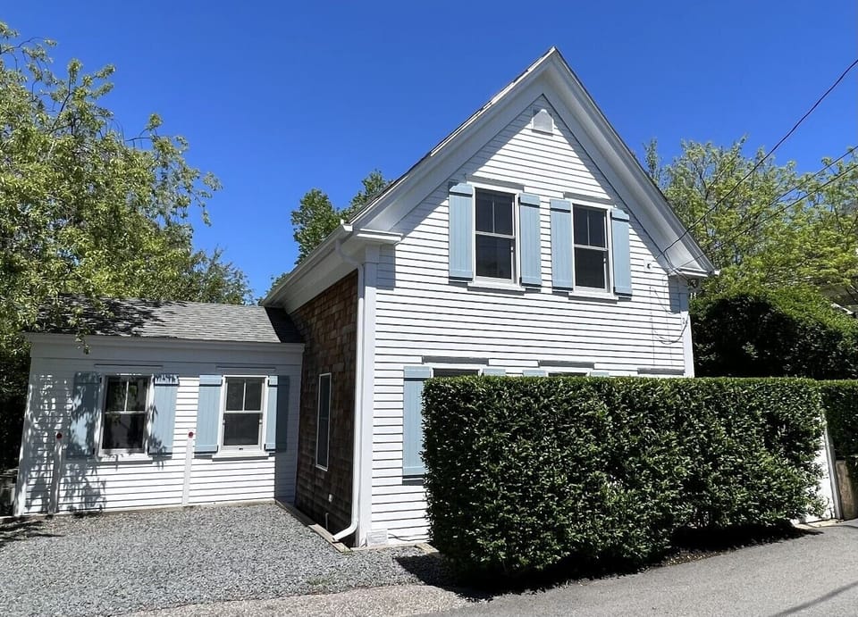 The house is located on a quiet West End St. Parking for up to 2 cars.
