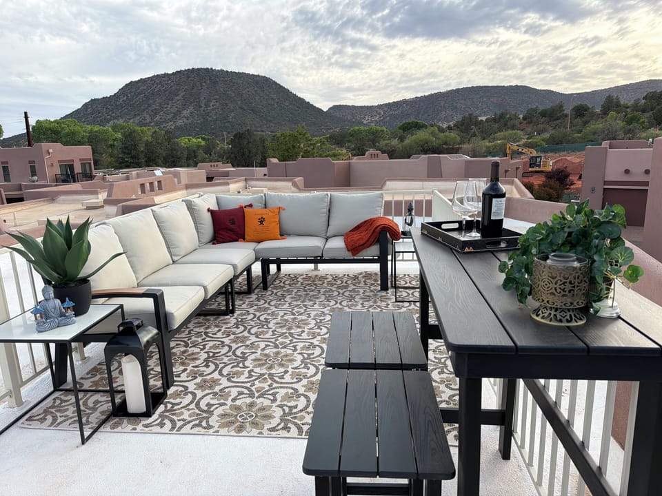 Comfortable rooftop seating with 360° views—perfect for morning coffee or sunset