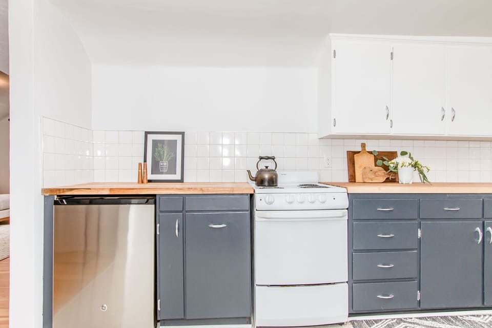 Cute new kitchen with butcher block countertops