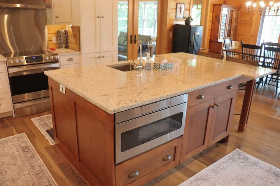 Kitchen Island view & built in stainless steel microwave