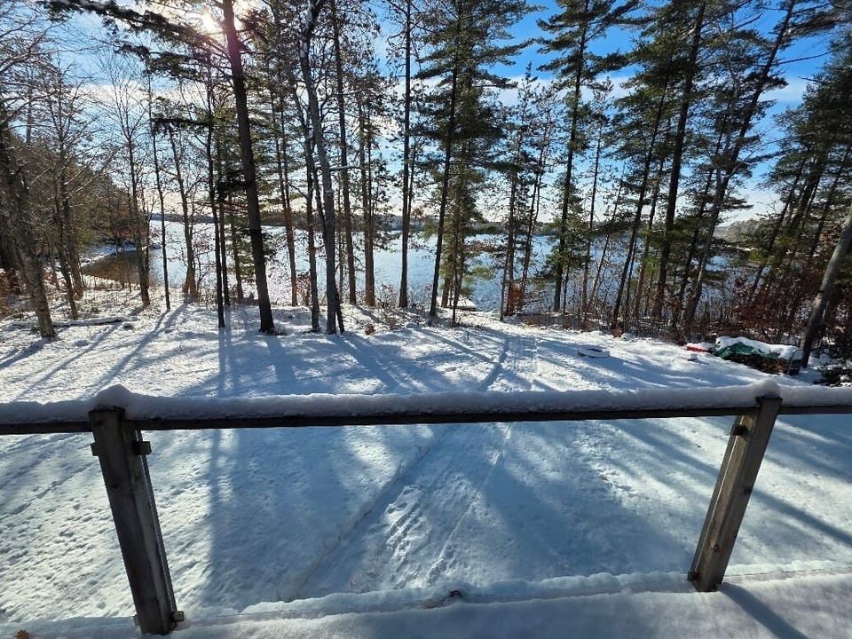 Walk out from great room to front deck.Magnificent view of lake and open space