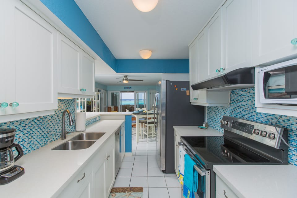 Fully equipped kitchen including a crock pot, blender, toaster, coffee maker etc
