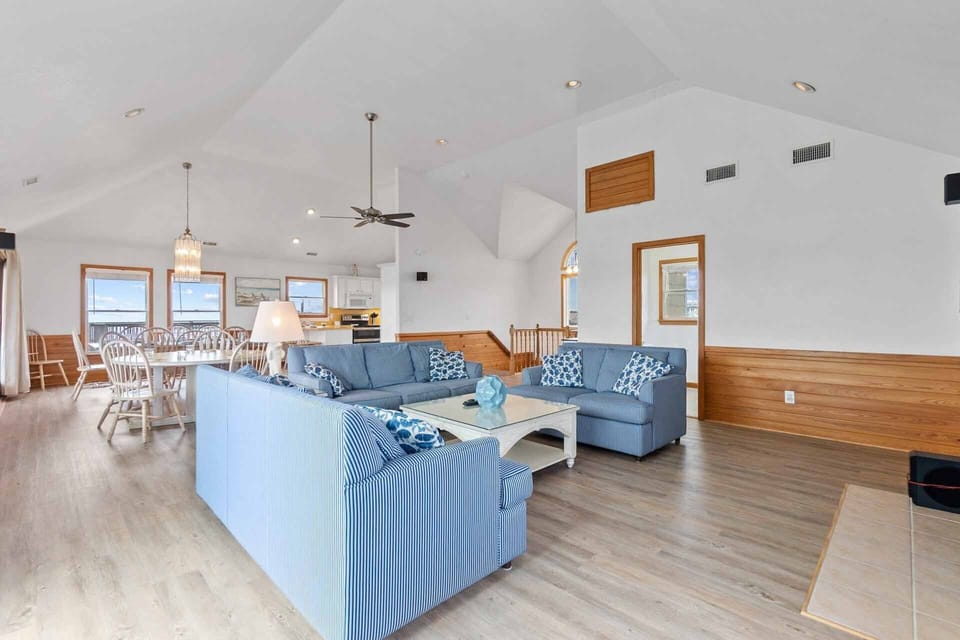 The top level great room encompasses a living area, dining area, kitchen, and full bathroom with Jacuzzi tub.