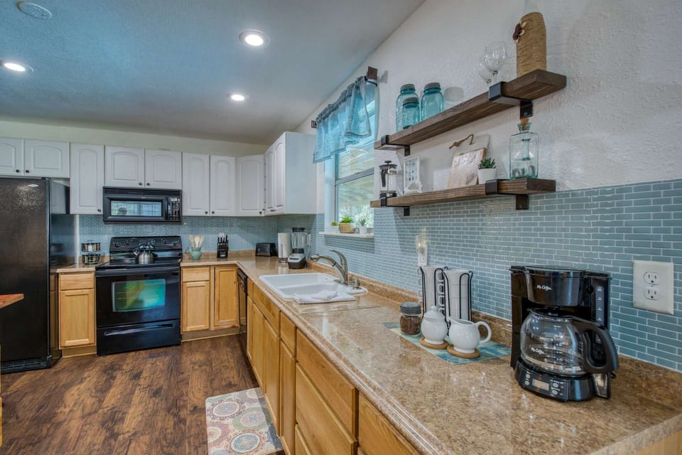 This spacious kitchen has everything at your fingertips to cook and serve a meal or just fix a quick pot of coffee before heading out.