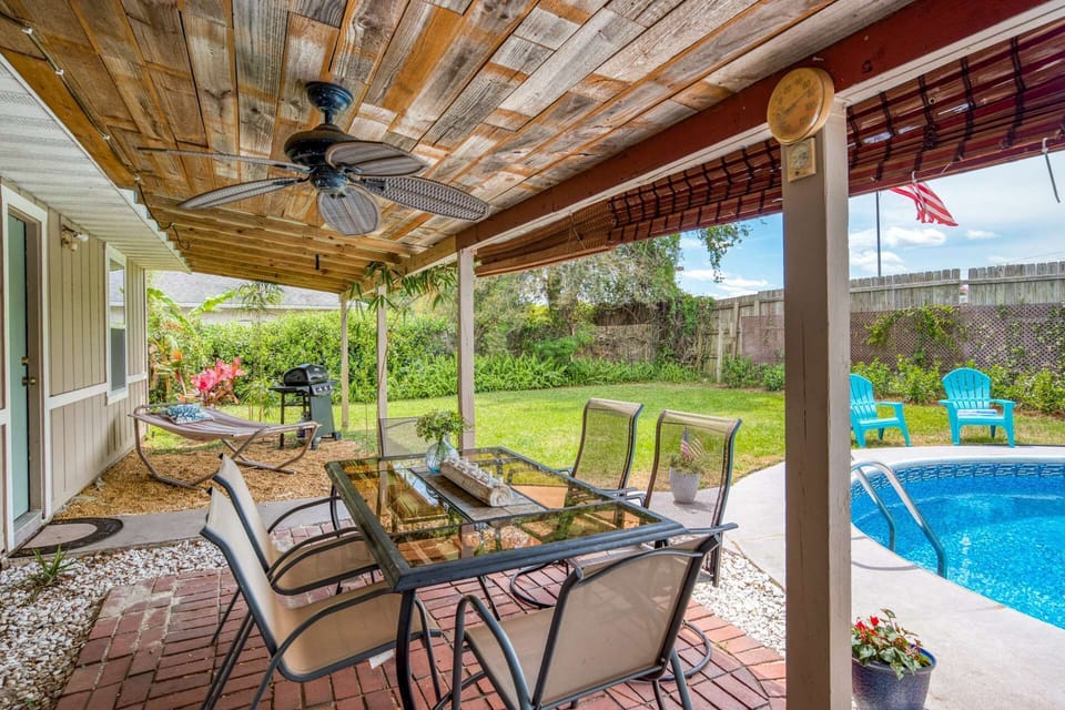 The back porch has dining, hammock, grill and access from the living space and master bedroom.