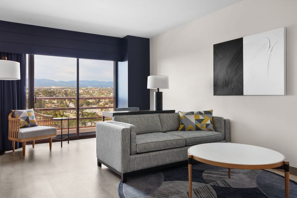 Suite, 1 Bedroom, City View | Living room | 32-inch Smart TV with cable channels, TV
