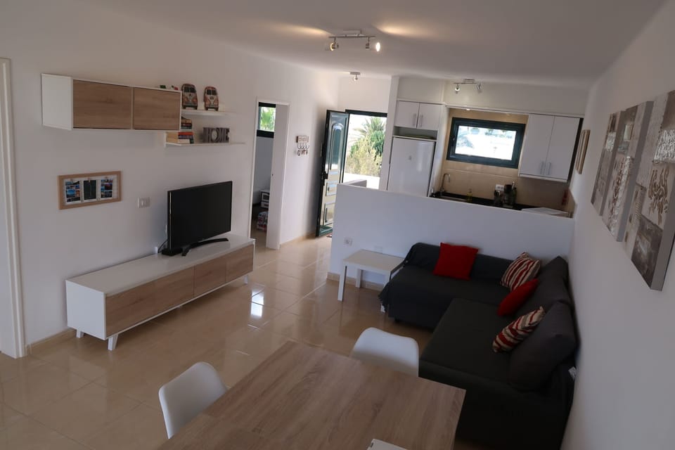 Living room with open plan kitchen