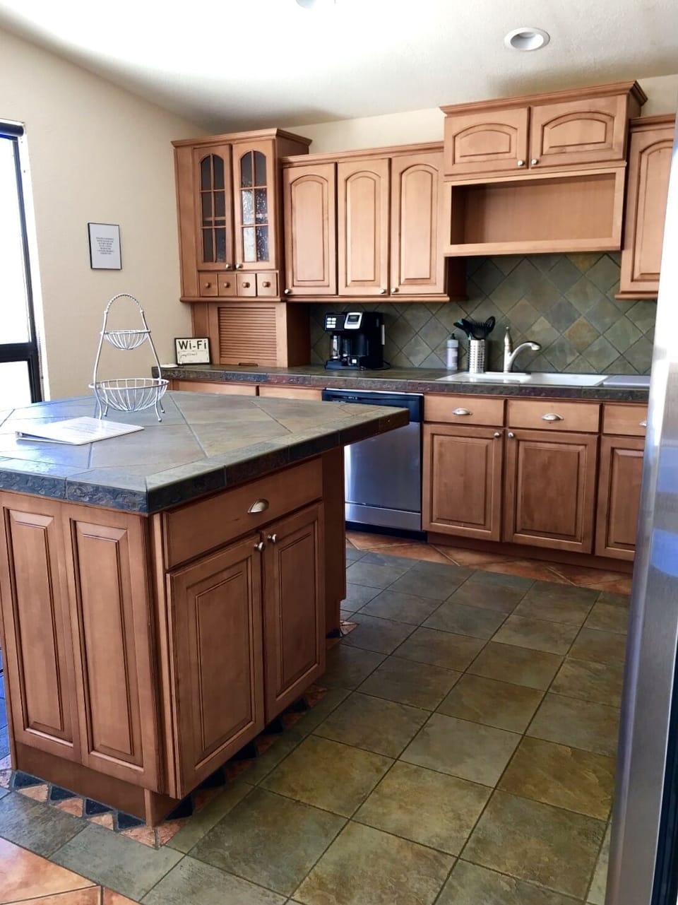 Cherry Cabinets in Kitchen with Stainless Steel Appliances