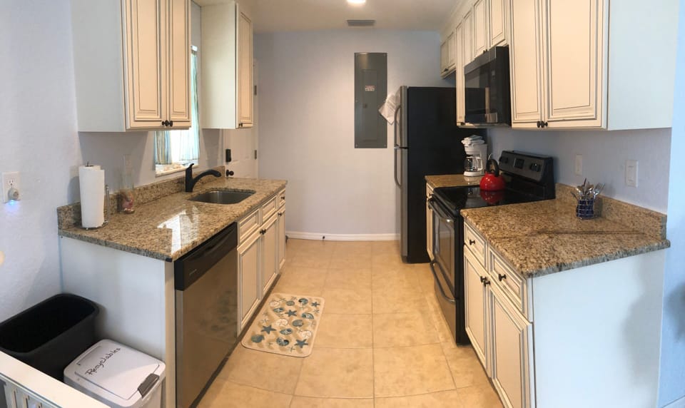 Kitchen area dishwasher sink stove refrigerator plenty of counter top space