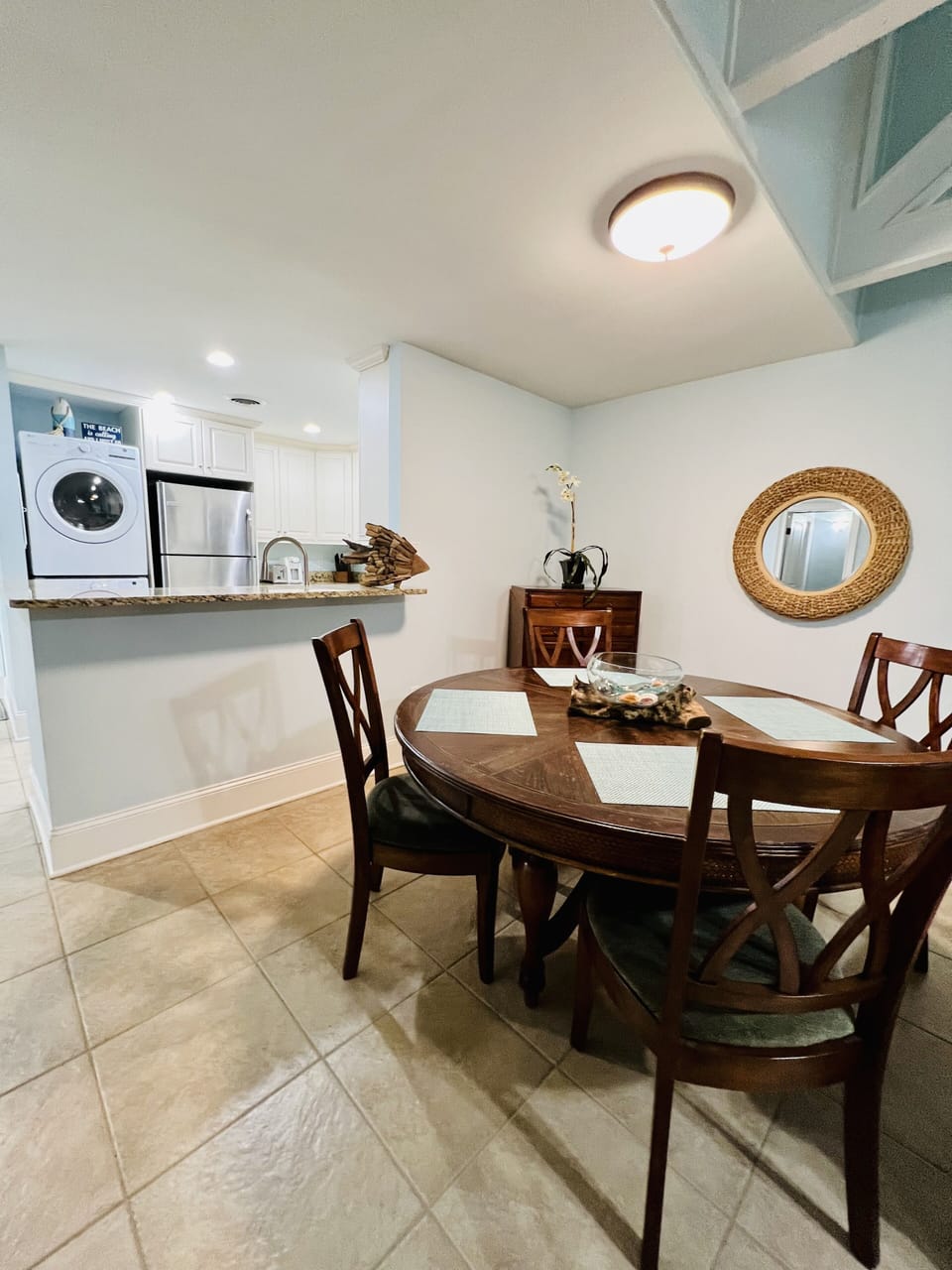 The fully stocked kitchen is opened to the dining area and living space.