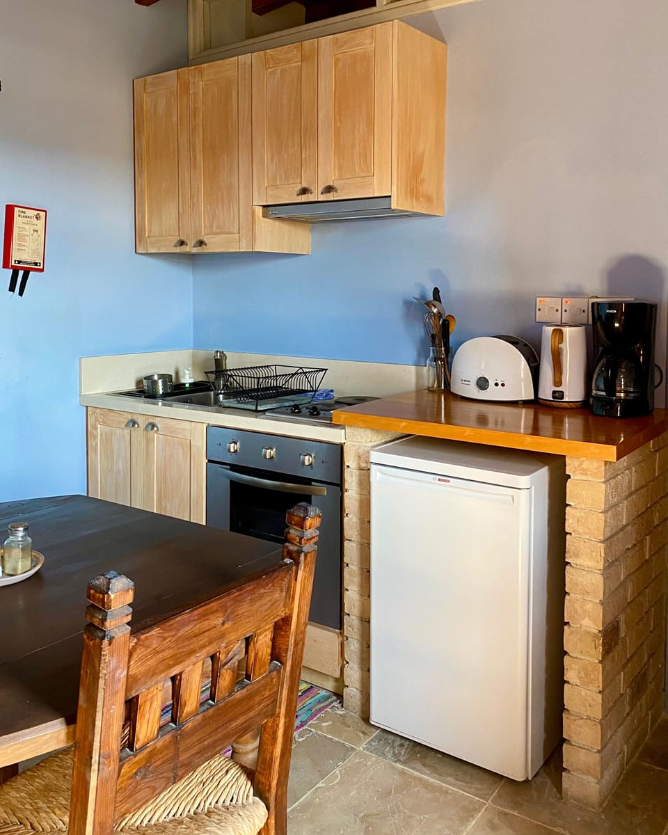Apartment, 1 Bedroom | Private kitchen | Coffee/tea maker, full-size fridge, oven, stovetop