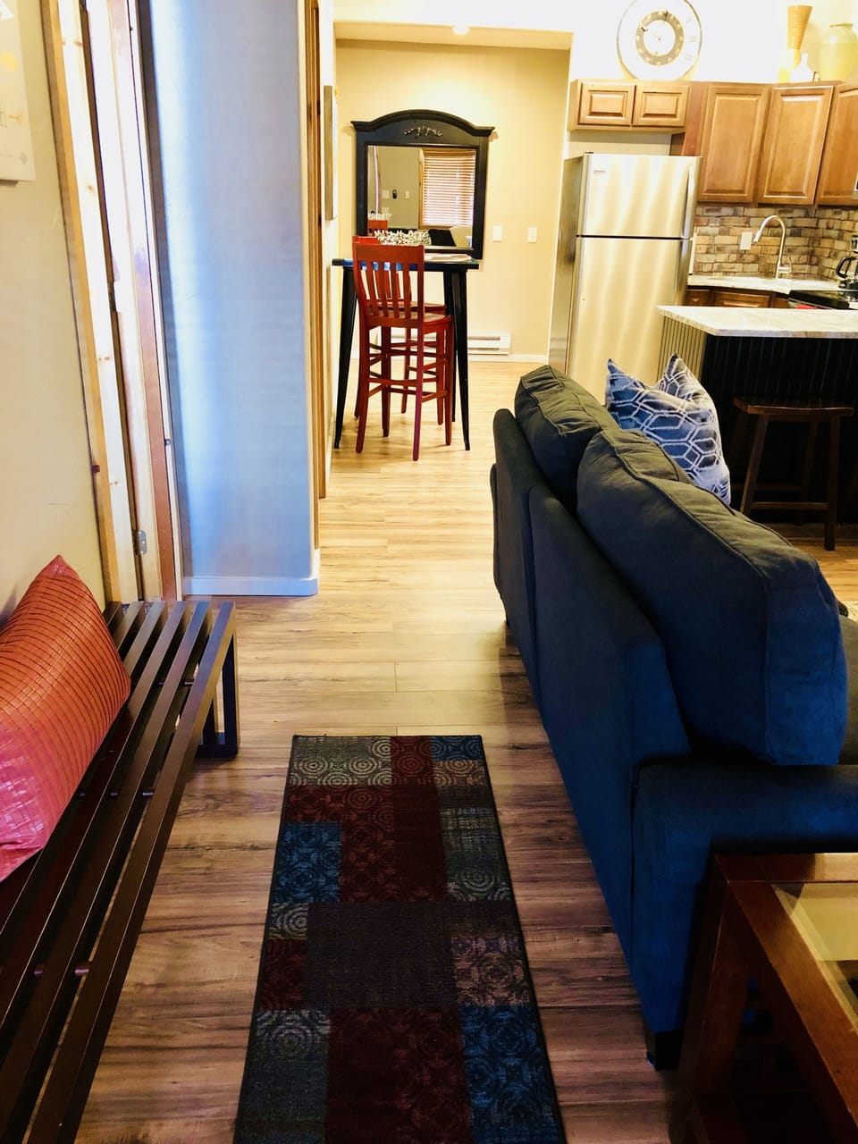 Entrance into this spacious cozy condo. A bench to put your shoes on!