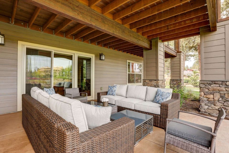 Covered patio off lower level living area invites you outdoors