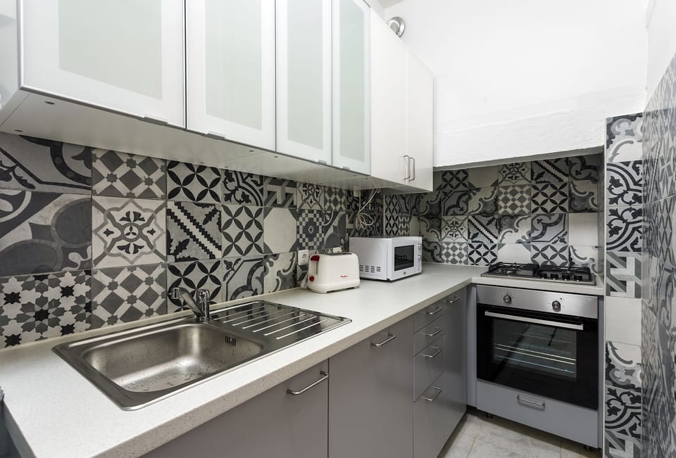 Apartment, 2 Bedrooms | Private kitchen | Full-size fridge, microwave, stovetop, dishwasher