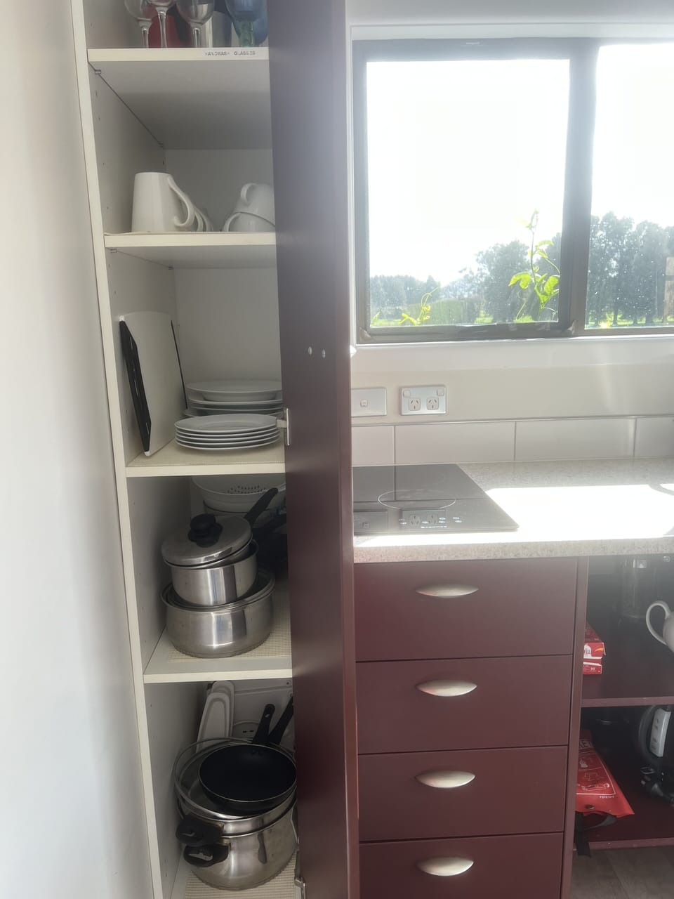 Pots, pans, crockery, cooking utensils.
Cooktop, lean mean grilling machine.