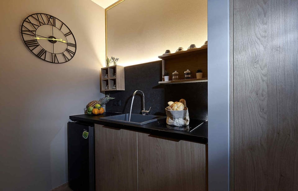 small kitchen with Fridge, cooker, coffeemaker, toaster