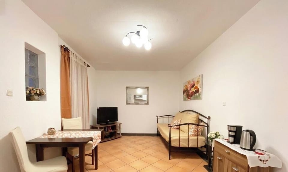 Apartment, 1 Bedroom | Living area | Flat-screen TV