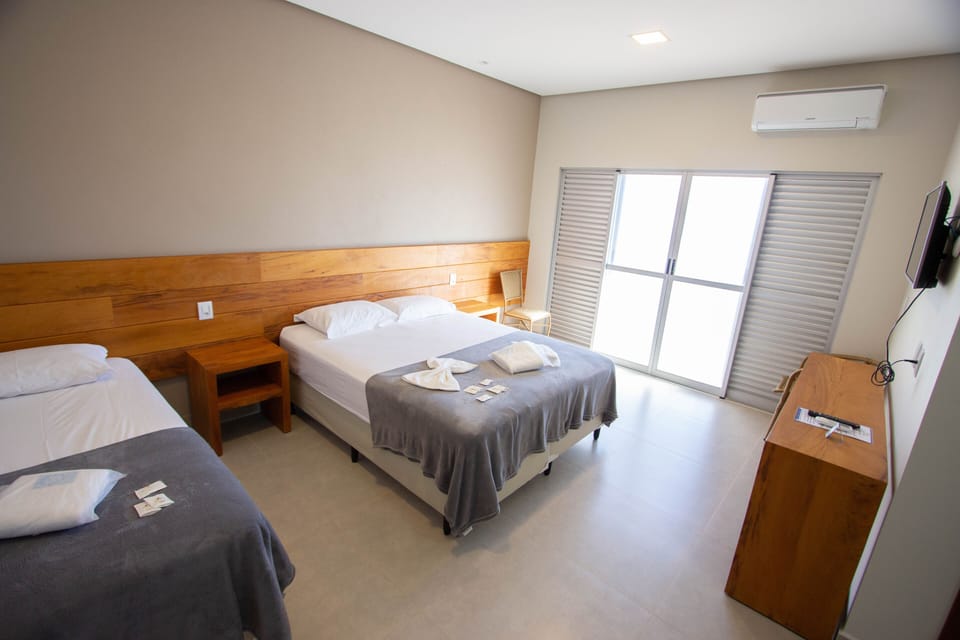 Deluxe Suite, Lake View, Ground Floor | Minibar, desk, free WiFi, bed sheets