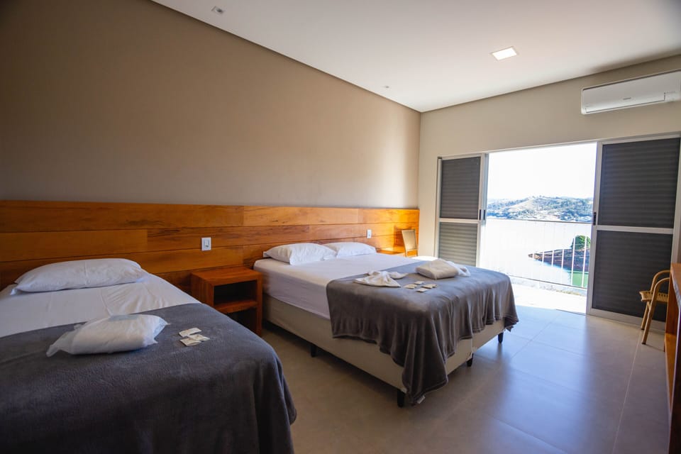 Deluxe Suite, Lake View, Ground Floor | Minibar, desk, free WiFi, bed sheets