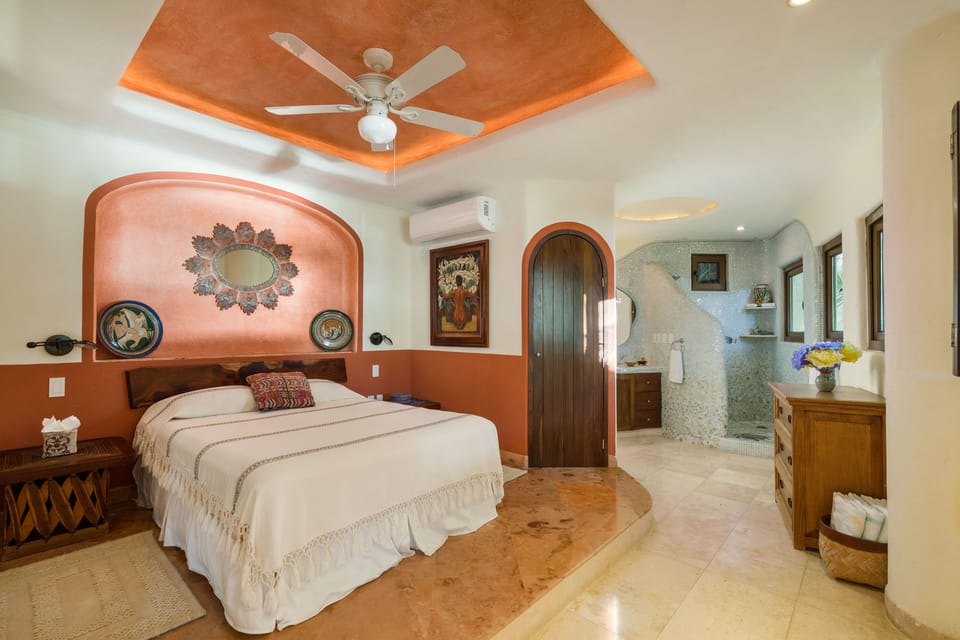 'Red Bedroom' looking onto bathroom in background.