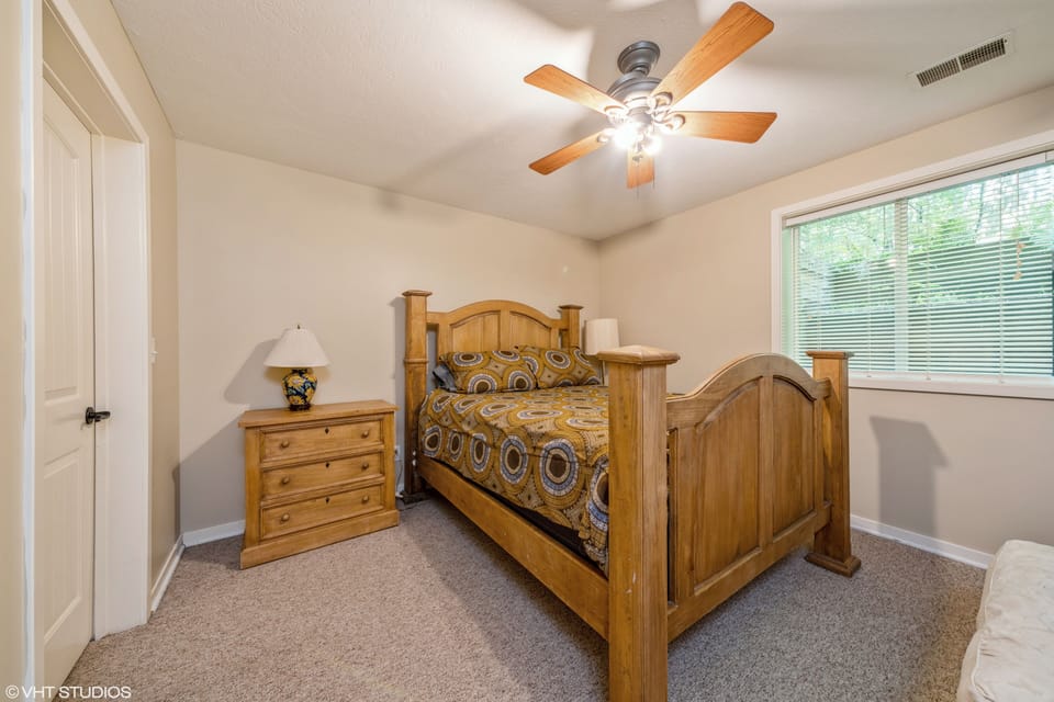 Basement bedroom w/ queen bed.