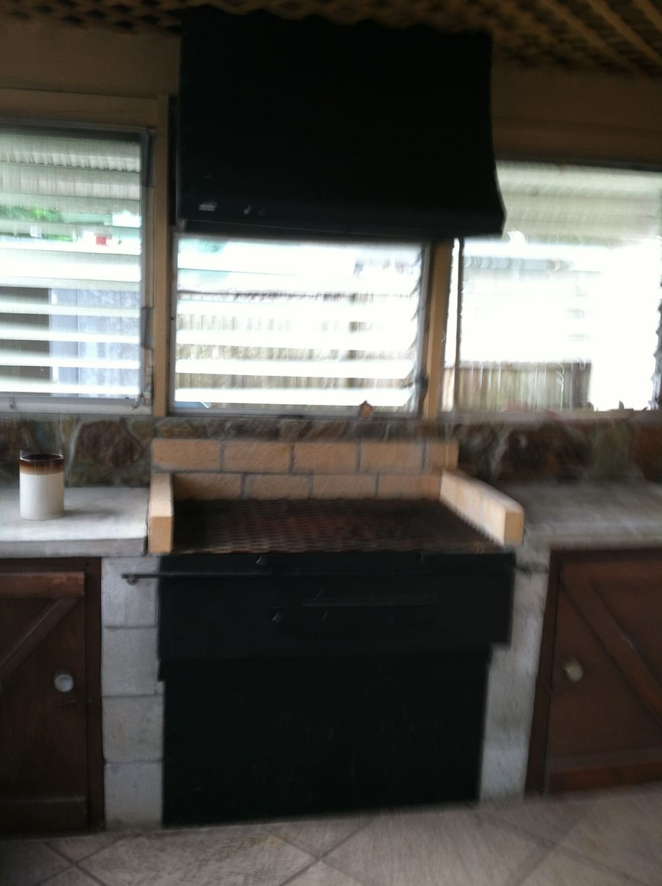 Indoor grill house with charcoal and gas grill's.