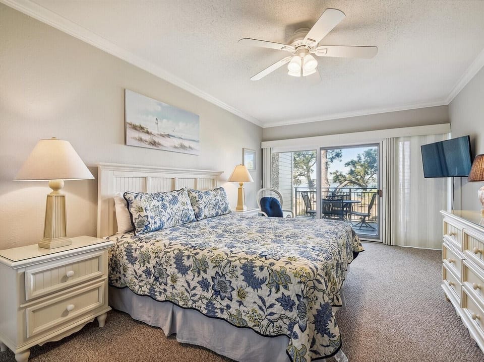 Master Bedroom with Private Balcony Access at 1890 Beachside Tennis
