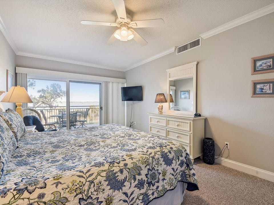 Master Bedroom with Private Balcony Access at 1890 Beachside Tennis