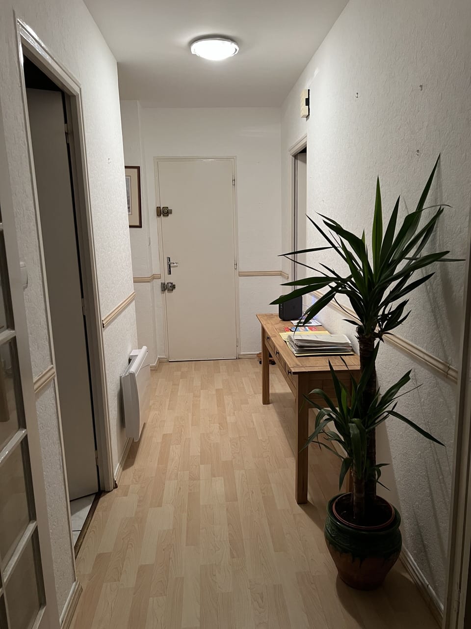 Entrance hallway, information book left out and instructions plus Modem