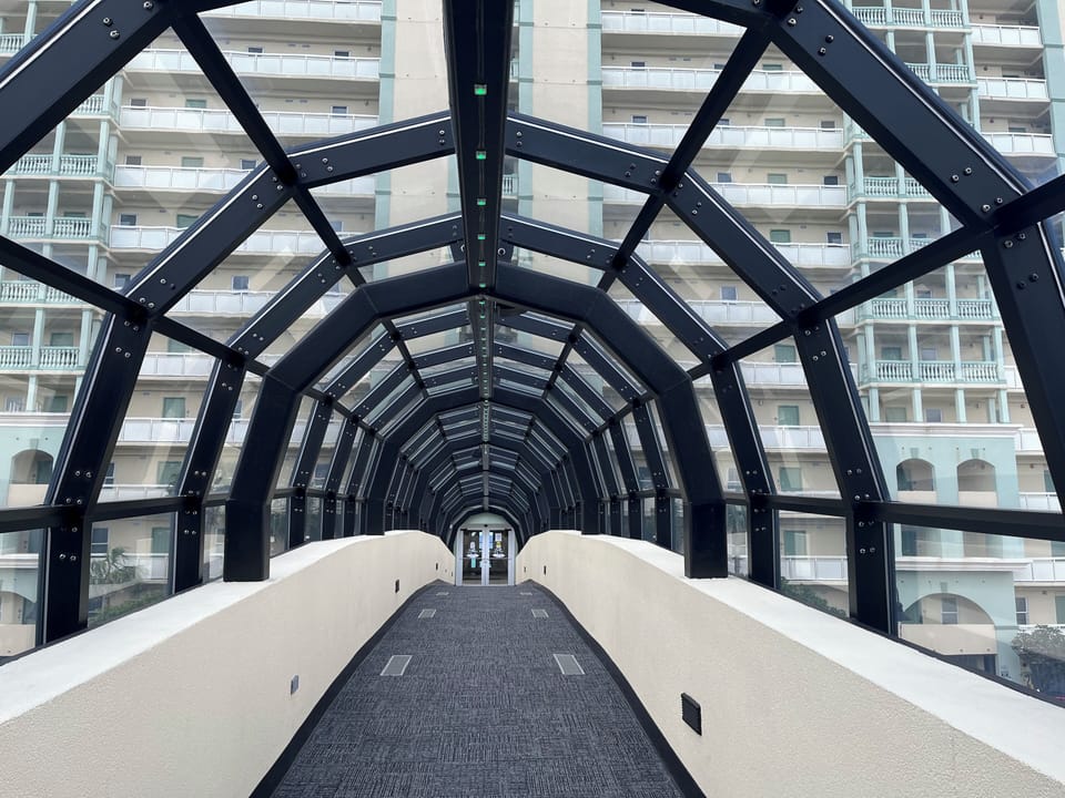 Climate controlled covered walkover from parking deck to main building