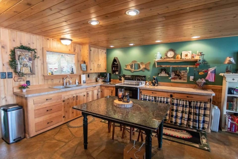 Creating meals and creating Memories.  Our kitchen is fully stocked with cooking supplies.  A stove, oven, microwave, full sized refrigerator, coffee pot, tea kettle, electric griddle, and waffle maker are all provided. 