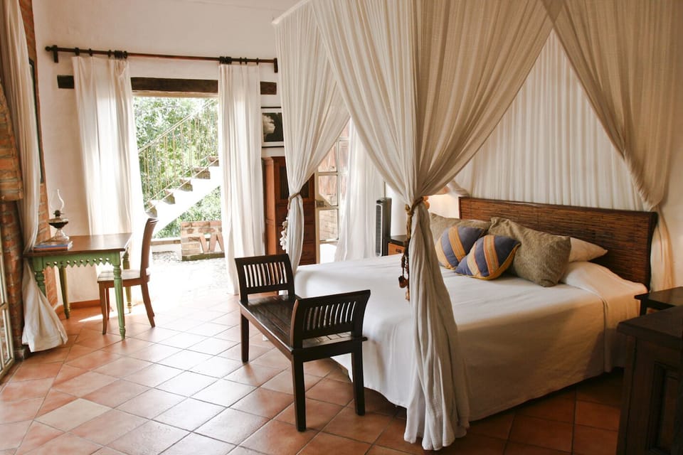 The romantic bedrooms are hung with flowing muslin and mosquito netting