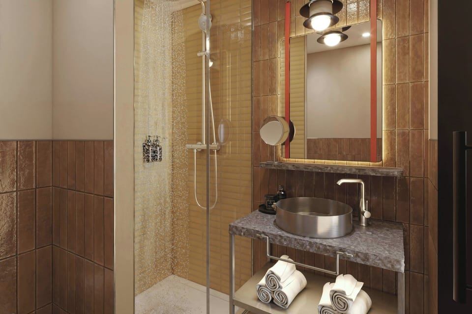 Eco-friendly toiletries, hair dryer, slippers, towels