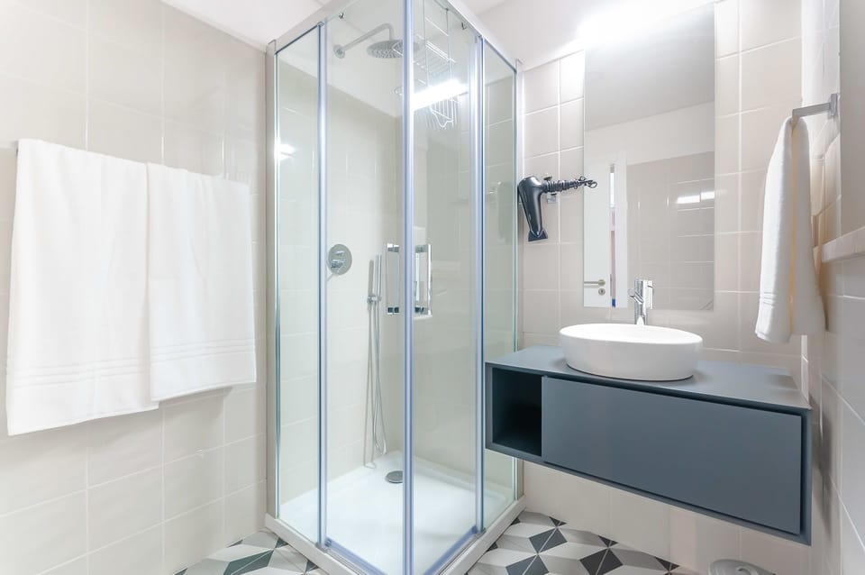 Standard Suite, 1 Double Bed, Private Bathroom | Bathroom | Shower, hair dryer, towels