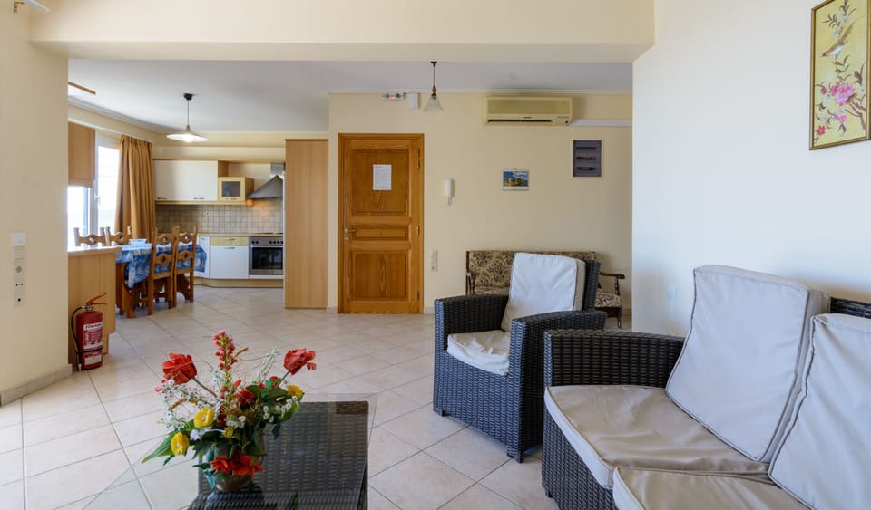 Standard Apartment, Sea View | Living area | Flat-screen TV