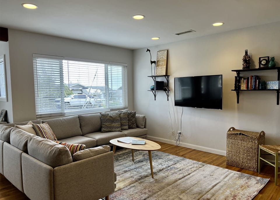 Living room with large couch and smart tv