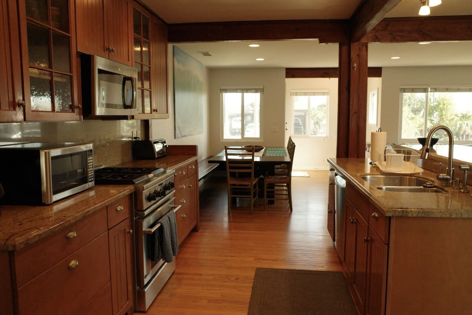 Fully equipped kitchen is open to the living room and dining area