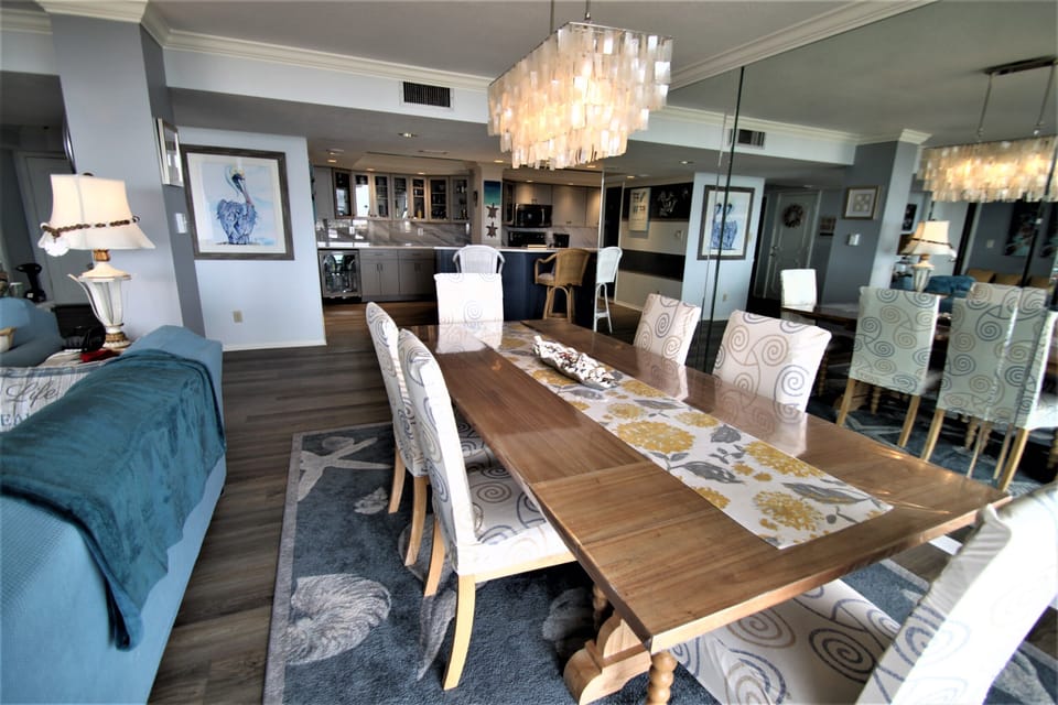 Large dining table can accommodate up to 8 with 6 chairs and a bench.