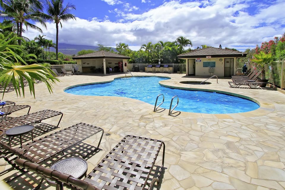 Pool with covered eating area and BBQs