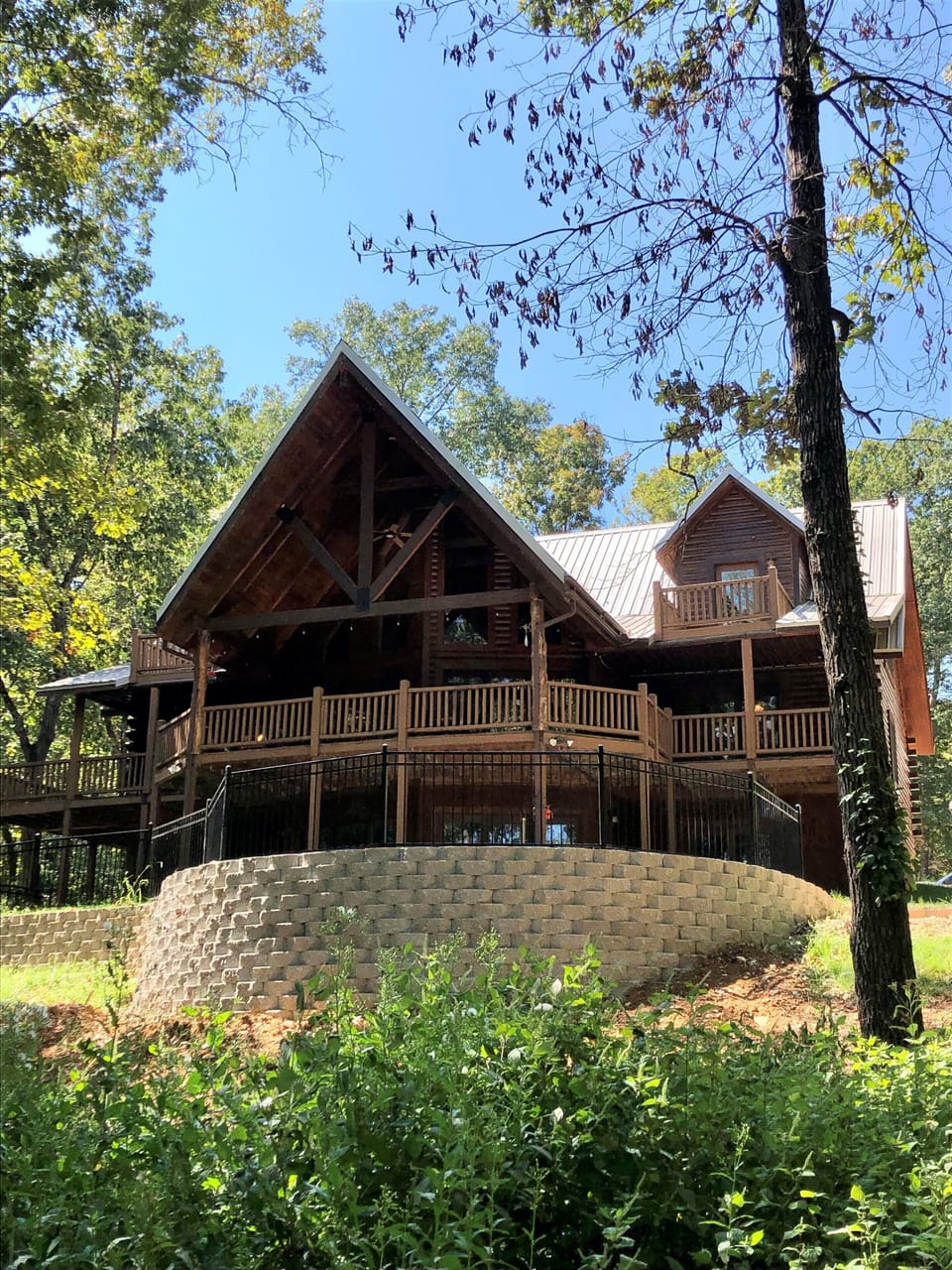 Back of cabin with gradual slope to the lake
