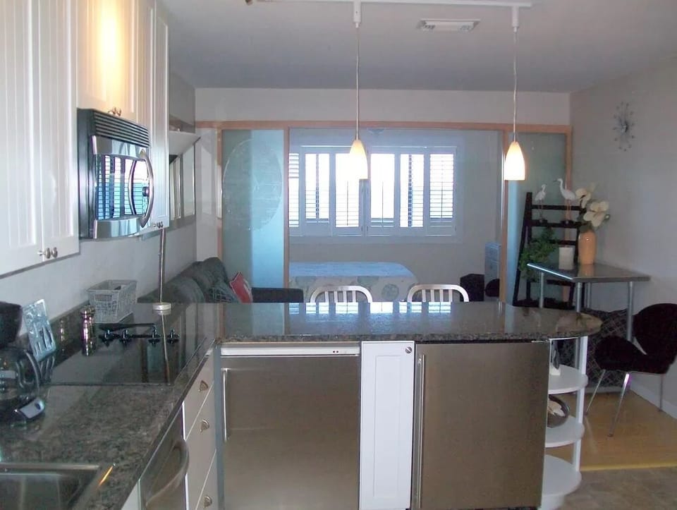 SS appliances, bright an open studio with fridge and separate fr