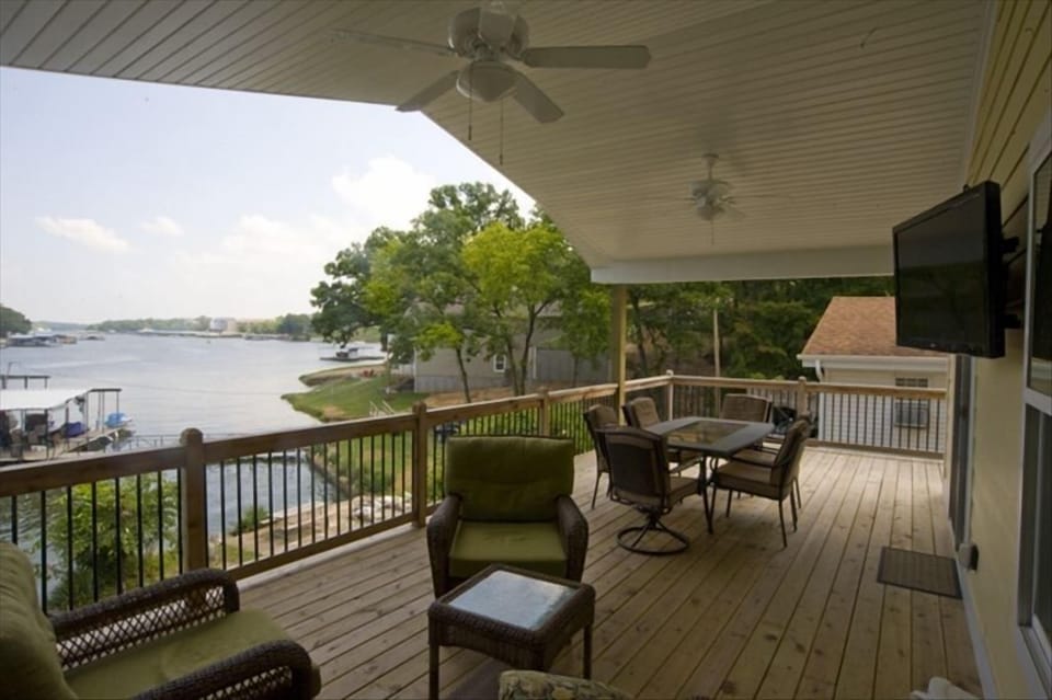 Huge deck with plenty of seating, a flat screen TV and a great view of the lake